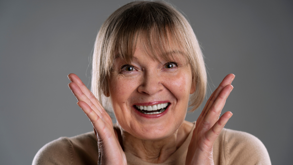 Patient smiling confidently after All-on-4 dental implant treatment in Costa Mesa