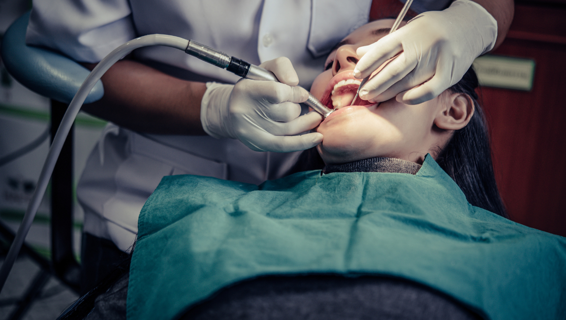 Costa Mesa dental team performing gentle wisdom teeth removal on a patient