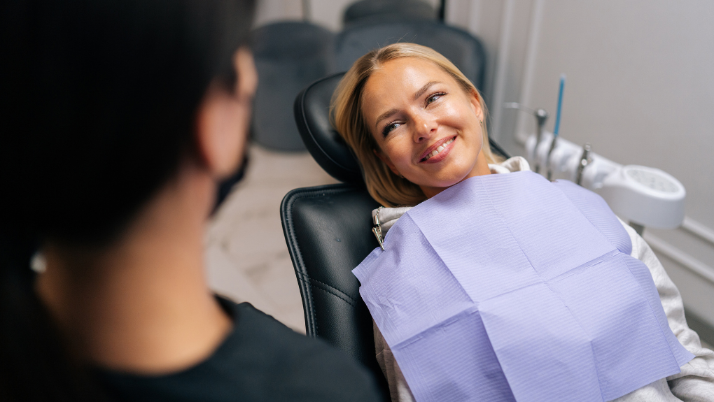 Cosmetic dentist talking through smile options with a patient at our Costa Mesa office